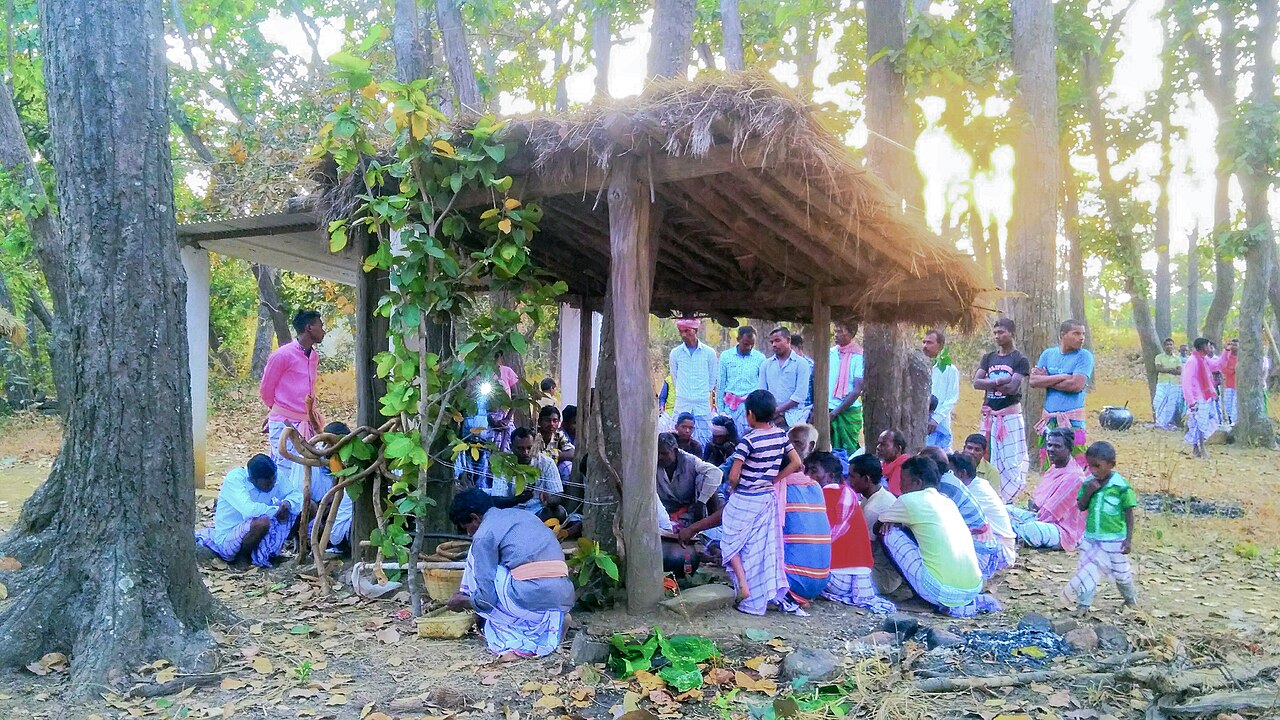 Santali community gathered at a Jaher Than sacred grove under sal trees